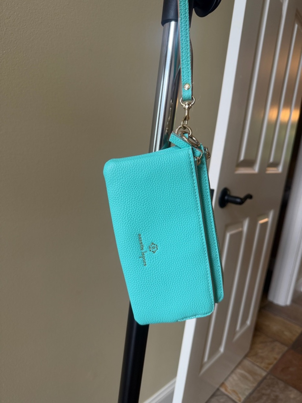 Nanette Lepore turquoise pebbled wristlet with gold hardware
